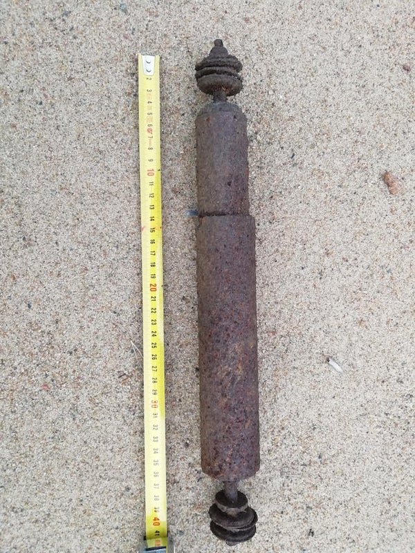 What is this? Its metal and somewhat heavy. As the picture shows its 40 cm long.

A: It’s a shock absorber.