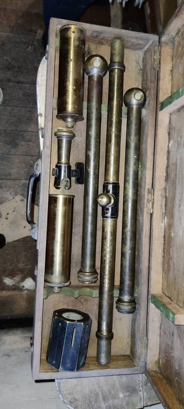 Is this a scientific instrument ? What for? Composed of several hollowed metallic tubes. two have a mirror at the end (in the spherical end). There is also a hollowed octogonal piece with slits about 1-2 mm width.

A: It’s a surveyer level