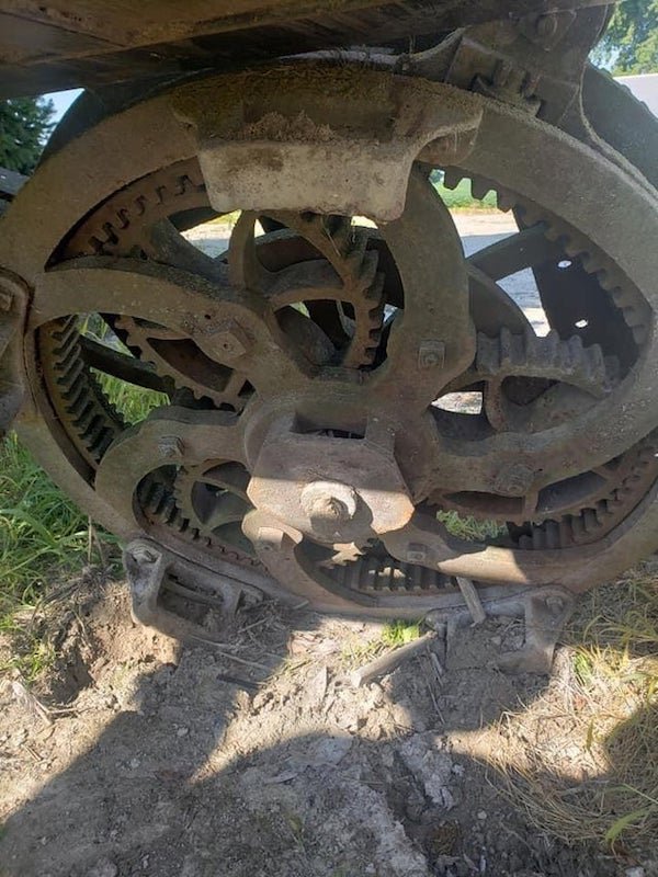 What is this antique piece of equipment? 4 feet across, solid heavily weathered metal and was used on a family farm in the Midwest USA that has been active since 1860s. The piece hasn’t moved since the 1950’s.

A: It’s a planetary gear. It has been removed from the machine it transfered power to.