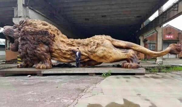 massive things with a human for scale - biggest lion sculpture - N