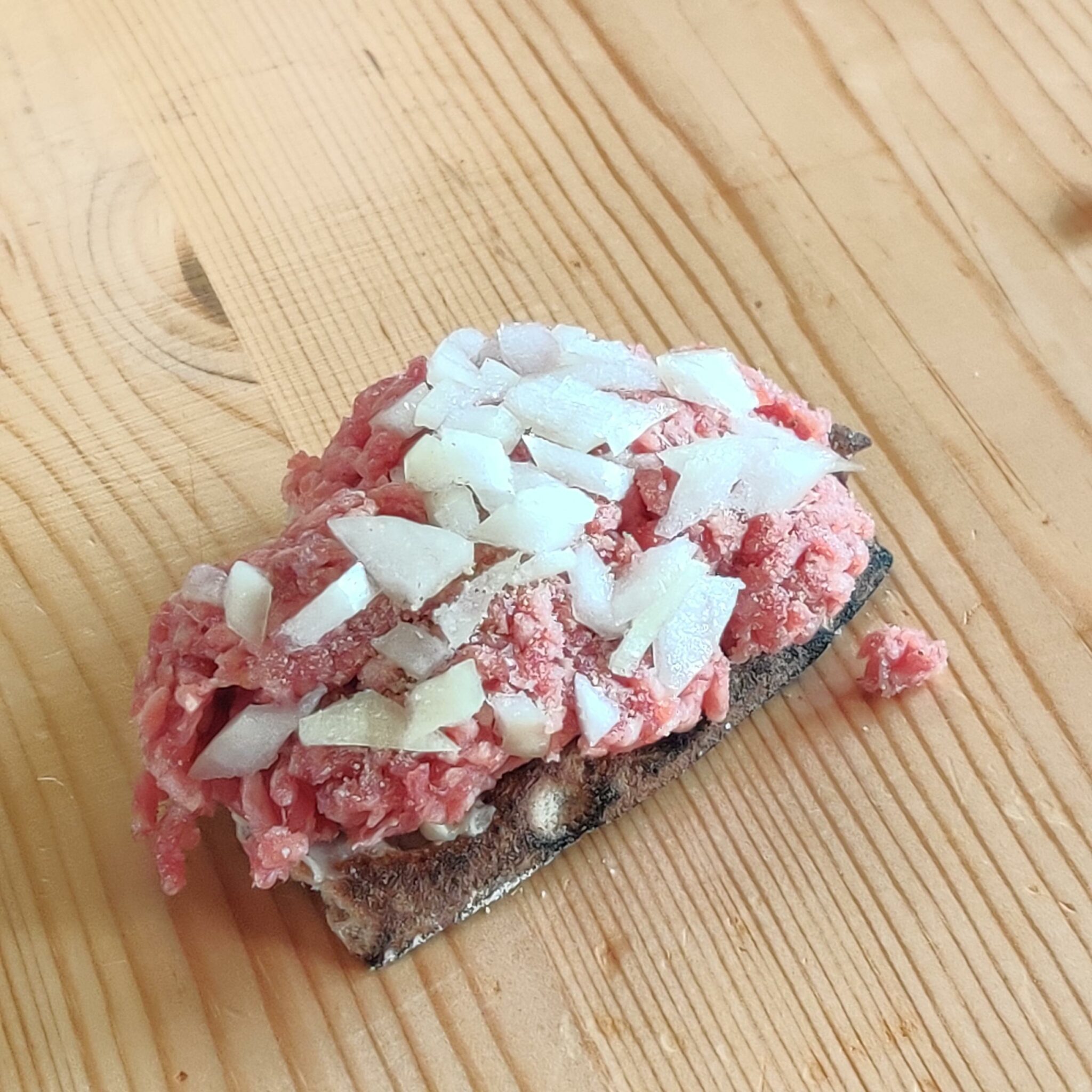 Raw Onions On Raw Hamburger Meat (not recommended)