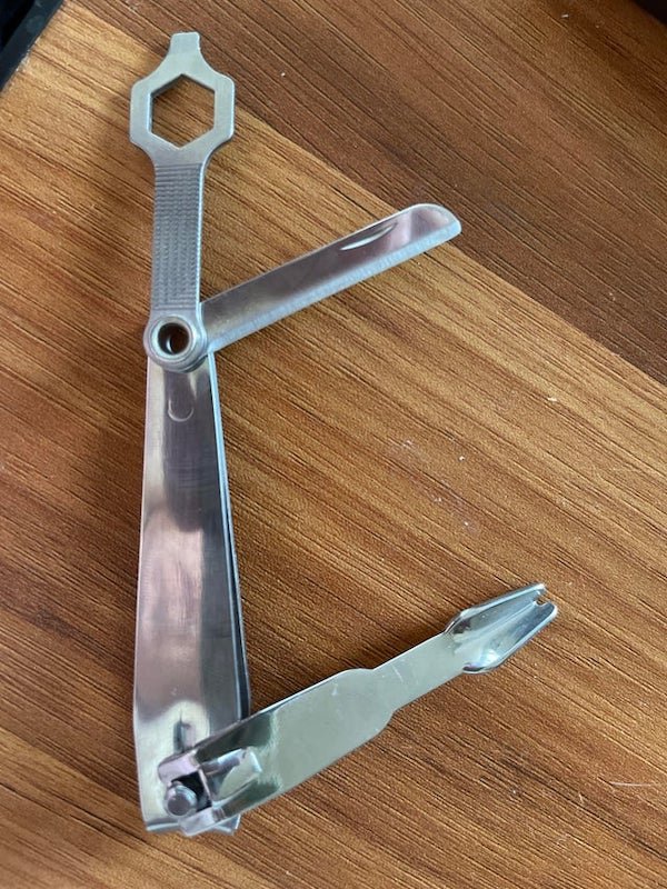 What are the tools on this pair of nail clippers? I found them in my grandpas old tackle box.

A: They’re intended for fishing — clippers are for clipping fishing line, clearly. A small knife for other cutting tasks. the notched spoon tool appears to be a knot tying aid. (The linked one is a little different version but is a similar setup)