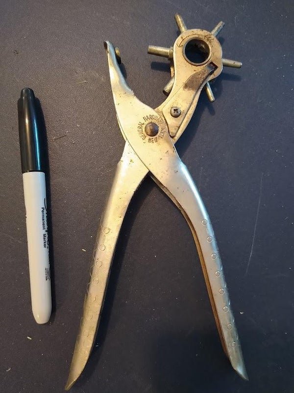 Found in older tool box (at least 10 years old). part with spokes rotates, spokes (of different diameters) match up to hole in the oposite side of the tool. Sharpie marker for size.

A: It is for punching holes in leather or similar things. Like, for a belt.