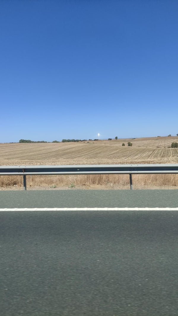 Tall tower shining a blinding light

A: It’s a molten sodium solar reactor.