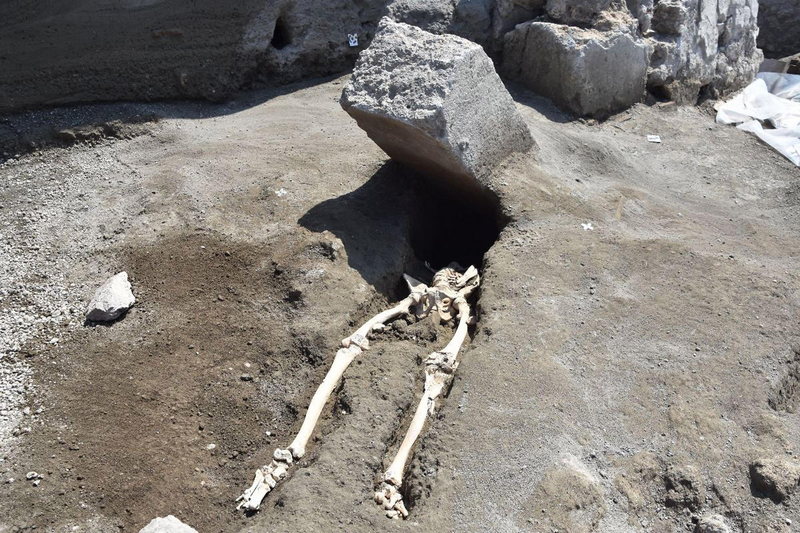 Skeleton of a Roman man beheaded by flying stone when Mt. Vesuvius erupted in Pompeii, Italy