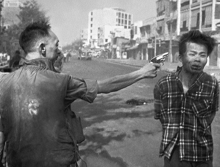 Execution of Nguyễn Văn Lém (Saigon Execution) captured by war photographer Eddie Adams
Nguyễn Văn Lém, often referred to as Bảy Lốp, was a member of the Viet Cong. He was summarily executed in Saigon during the Tet Offensive in the Vietnam War, when the Viet Cong and North Vietnamese forces launched a massive surprise attack. Lém was alleged to have murdered a colonel and eight members of his family before being captured.

Lém was brought to South Vietnamese brigadier general Nguyễn Ngọc Loan, who then executed him. The event was witnessed and recorded by Võ Sửu, a cameraman for NBC, and Eddie Adams, an Associated Press photographer. The photograph and film became famous images in contemporary American journalism, and won Adams the 1969 Pulitzer Prize for Spot News Photography.