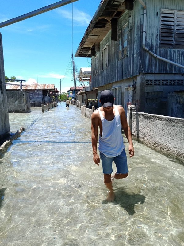 A clear water flood in a town in the Philippines.