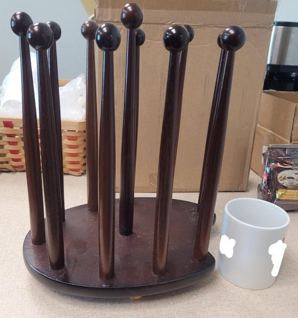 Wooden thing, found in church/school, mug for scale

A: It’s a wooden version of a boot rack used for drying boots.