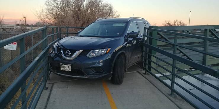 "Nissan Rogue driver gets stuck making a turn on a Denver Bike Path foot bridge"