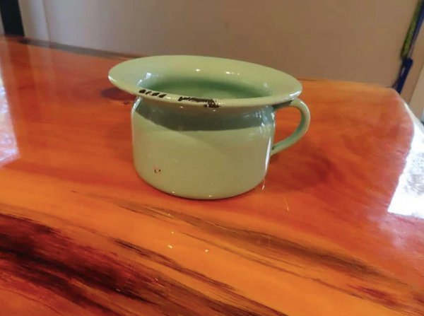 Found at an antique market in Wisconsin USA. About 6″ across the top, the hole is about 3.5″. Tiny spittoon?!

A: Child’s chamber pot