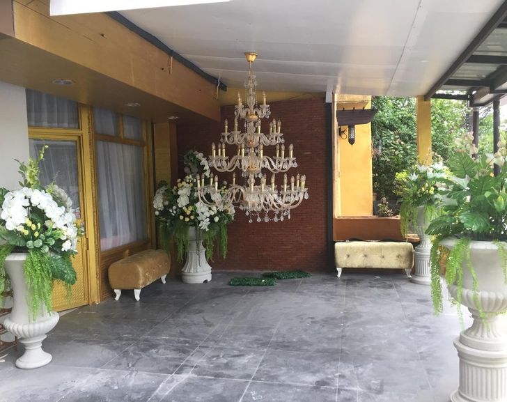 “The chandelier adds luxury and complements the fake orchids.”