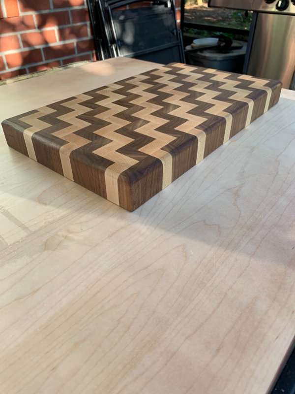 “End grain cutting board I made from maple and walnut.”