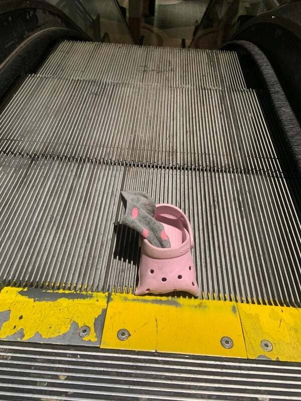 Some poor kid’s croc and sock jammed in the escalator.