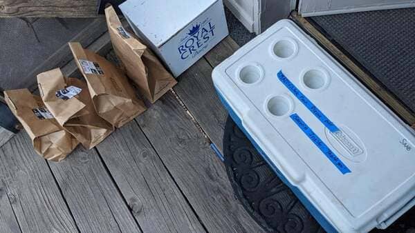 Amazon leaving our groceries next to the cooler instead of inside, despite a clear label. All dairy ruined.