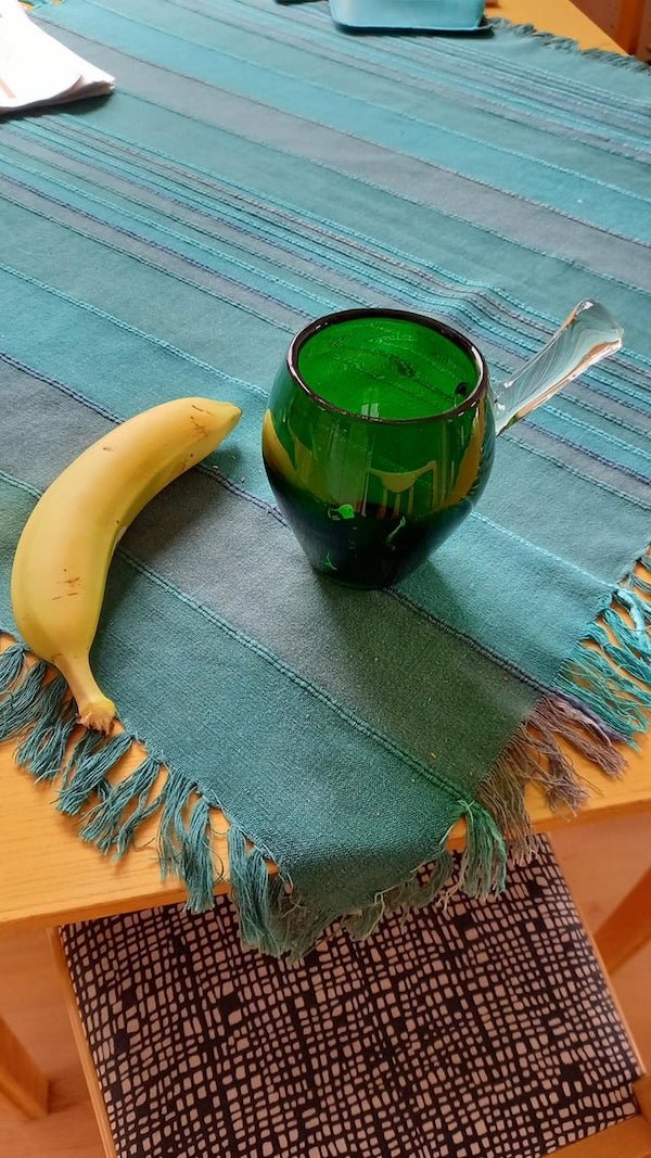 Some sort of glass bowl with a handle, no markings. Banana for scale.

A: It’s just a mug with a horn