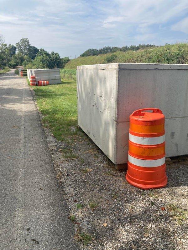 Large concrete containers with slab lid. Completely enclosed. Being buried together. Hundreds.

A: Spread out along a roadway makes me think they’re used for storm water retention and they will be drilled for pipe connections once they are buried