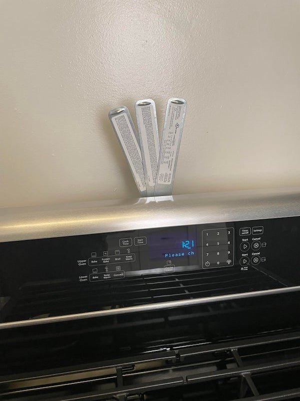 Does anyone know what this thing is on the back of my oven? Even the technician who put it in didn’t know.

A: Looks like it’s just the data plate. I’m guessing it’s installed like that so you can get the important info without pulling it all the way out away from the wall