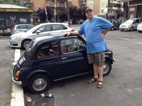 Me a few years ago standing next to cars in Italy (I’m 6’5″)