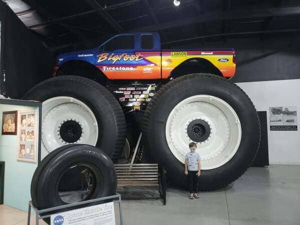 My 7 year old next to a 1999 Ford Bigfoot truck.