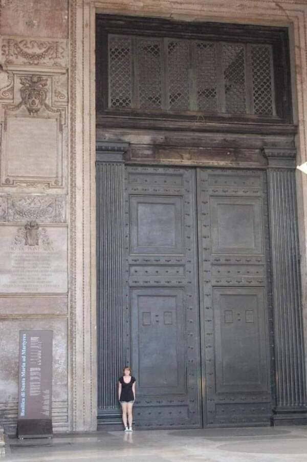 Oldest door still in use in Rome, at the Pantheon. Cast in bronze for emperor Hadrian’s rebuilding, it dates from about 115 AD. Each door is solid bronze 2.3 m wide & 7.5 m high, yet so well balanced they can be pushed or pulled open easily by one person.