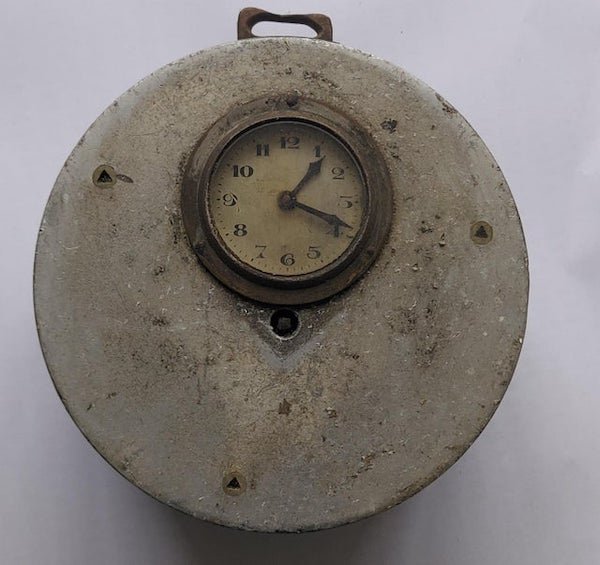 Some form of clock or timing device

A: Night Watchman’s clock. There’s a keyhole for the watchman to insert the watchkey and record the time he reached stations along his rounds.