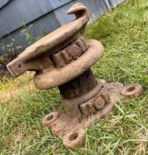 What is this thing. Made out of wood and metal. And bolts to a surface. No works or numbers on it

A: A ship and rope tie line anchor from an old wharf.