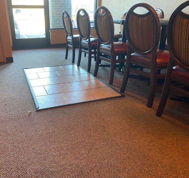 “This small tiled area in the middle of the carpet in this restaurant.”