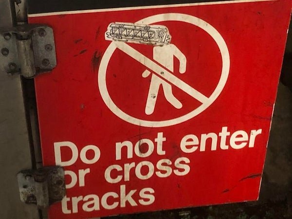 sign - Do not enter or cross tracks