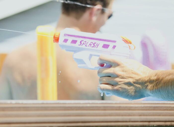 dumb rules and funny signs - pink and white splash water gun - Splash