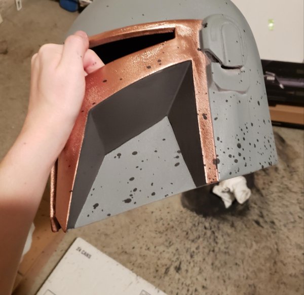 “Was just about to do the final layer of details and I dropped the container. This caused paint to spill everywhere. Including on my helmet.”