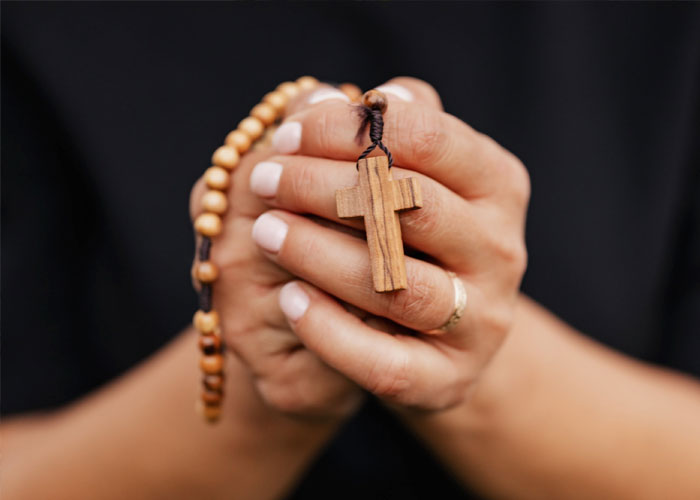 Madrid, Spain:
The lucky rosary: an older gypsy lady will come up to you with a rosary and as soon as she gets the chance she's going to start telling you your fortune. As soon as she's done she's going to ask you to pay between €5-€25. Avoid this scam by just not letting her give you the rosary and walking away.