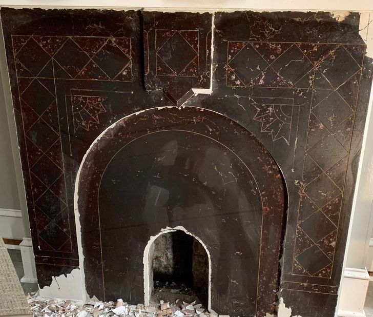 “Just removed latex paint from my fireplace to discover the original slate tile with faux marble, painted finish intact.”