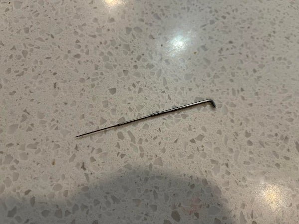 My dog brought this in. I was thinking maybe it’s a lockpick but I looked up lock pick sets and I haven’t seen anything that looks like this. It’s a very sharp metal object about 3 inches long.

A: It’s a felting needle