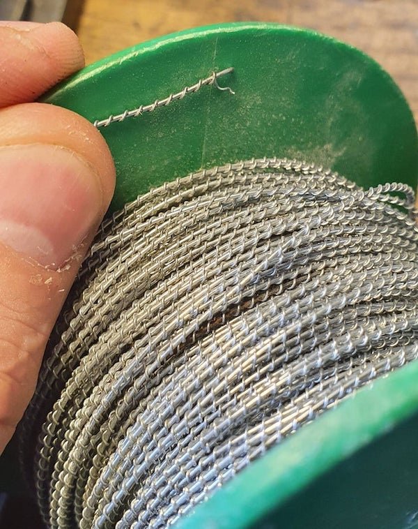 What is this steel wire, with a smaller gauge of wire wrapped around it, used for? Magnets are attracted to the metal, and it’s harder than aluminum (both core and wrap) so I’m guessing it’s stainless steel.

A: This looks like what you have Lead sealing wire. Used with security/tamper seals.