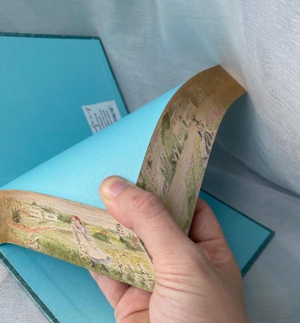 I create hidden fore-edge paintings. This is my latest within Anne of Green Gables.