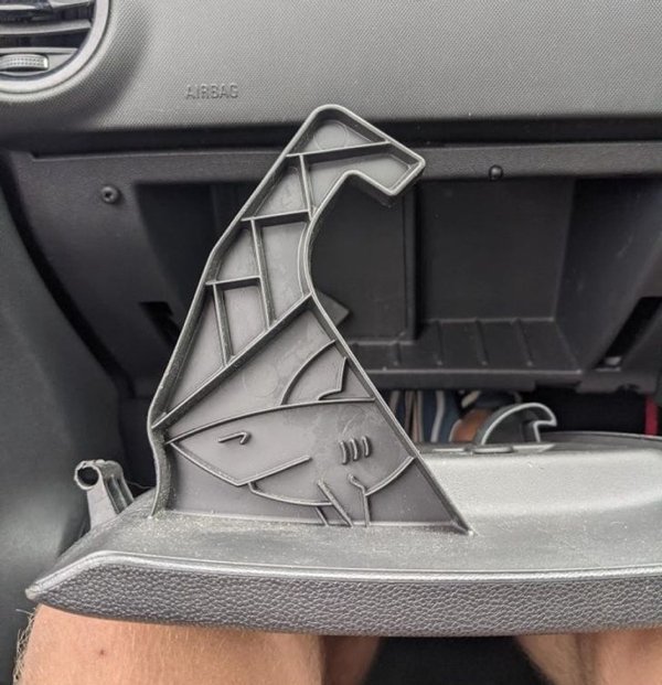 I found this shark hidden on the hinge of the glove box.