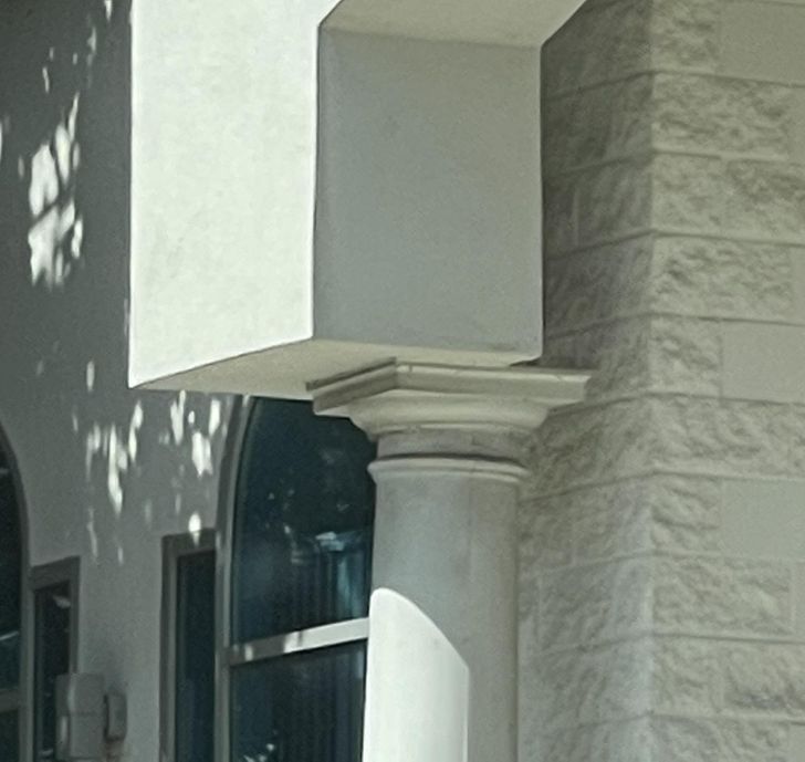 “An off-centered pillar on a building in my city”