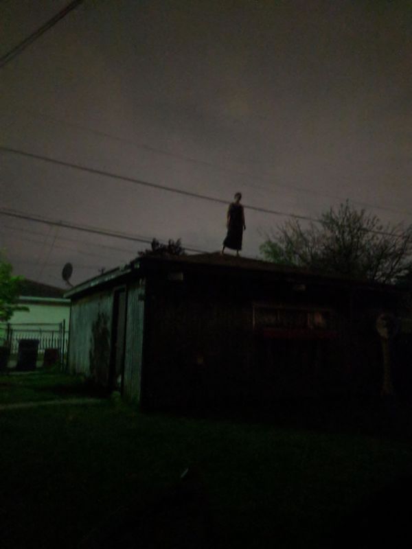 creepy and wtf pics - woman standing on roof