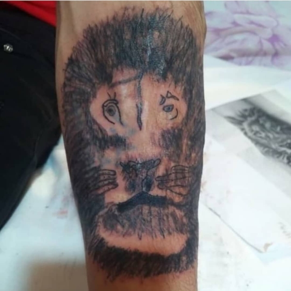 tattoo fails - lion tattoo fail -