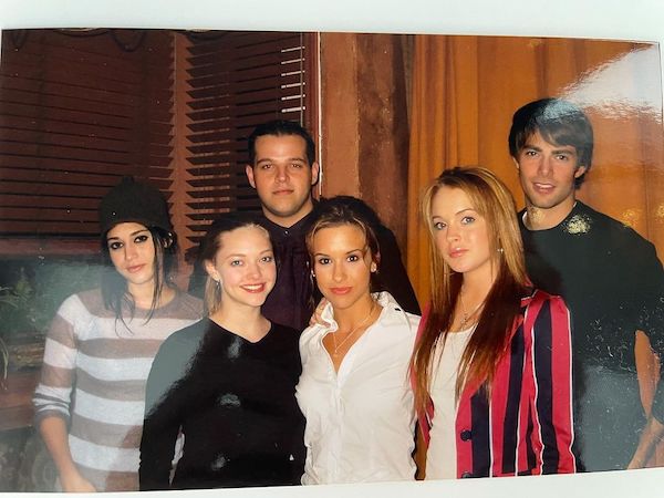 Lizzy Caplan, Amanda Seyfried, Daniel Franzese, Lacey Chabert, Lindsay Lohan, and Jonathan Bennett on the set of Mean Girls in 2003.