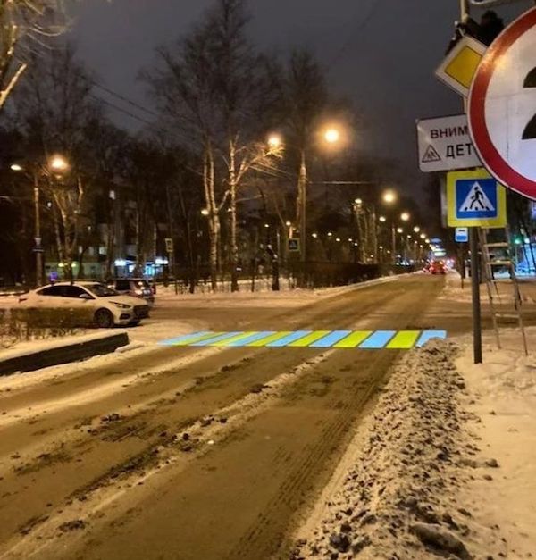 Crosswalk projected on a dirty winter road.