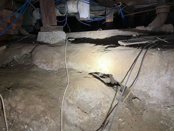 There appears to be a cave system leading down underneath this home’s foundation.