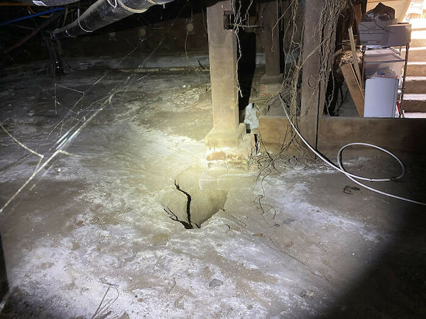 Here is a brick pier that’s sitting dangerously close to a big hole in the ground. Something tells me the homeowner will start to feel some dipping in the floors soon!