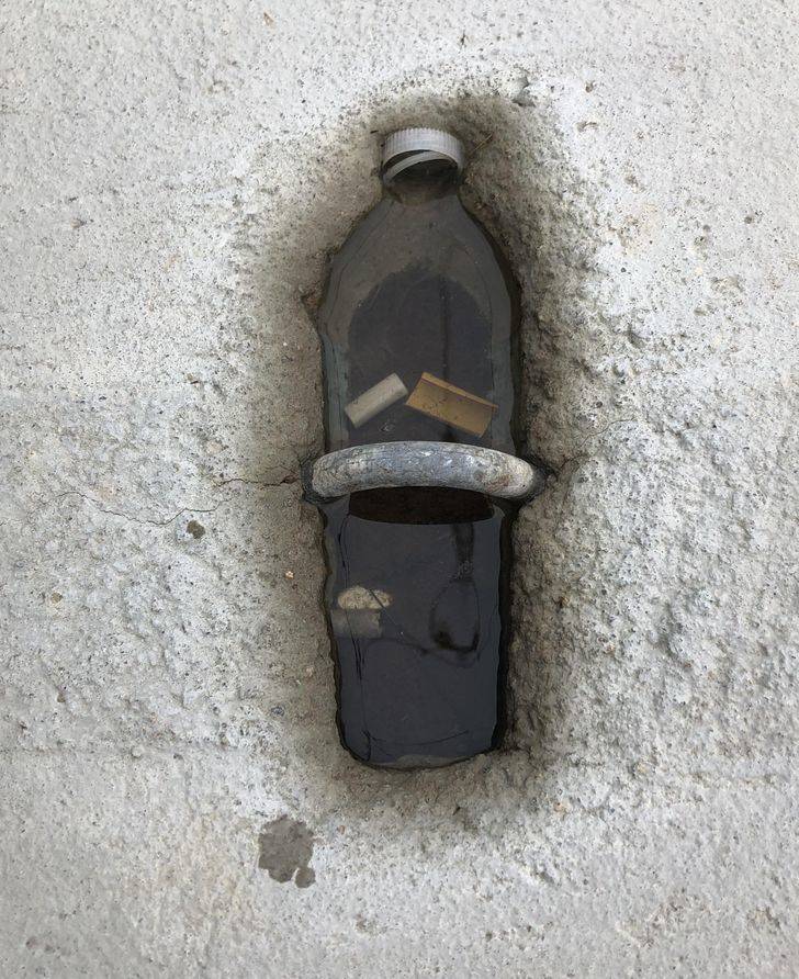 "This hole in the concrete looks like a water bottle."