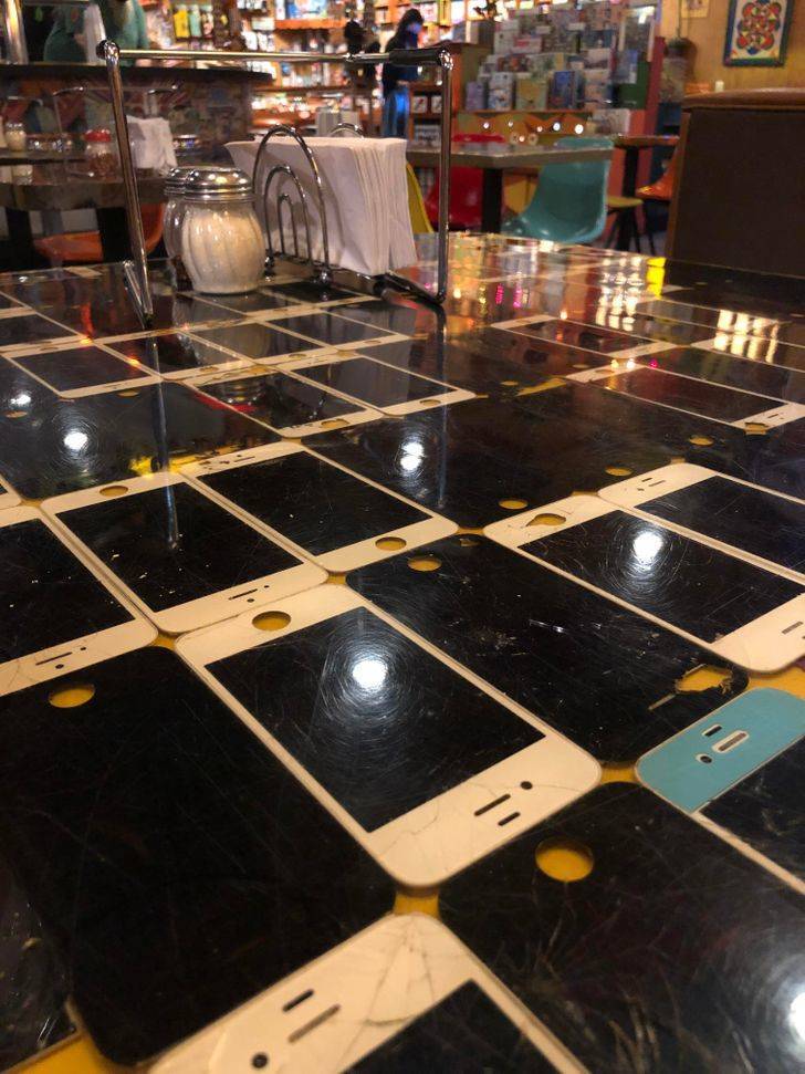 “My local pizza joint has a table made from old iPhones.”