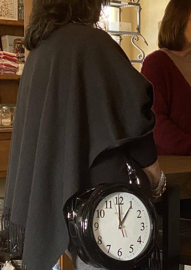 “This woman’s purse has a full size clock in it.”