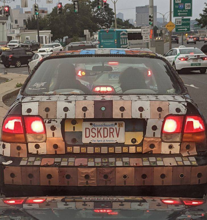 “This car is decorated with old floppy disks.”