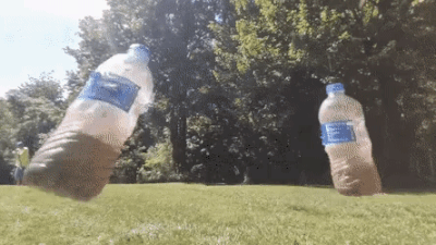 wins - wholesome - ftw- archery swinging bottles gif