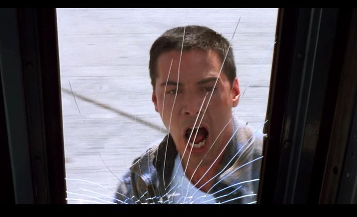 When Keanu Reeves runs up to the mined bus in Speed, he hits the bus door and breaks the glass. It happened accidentally, but the scene was kept in the final version of the flick.