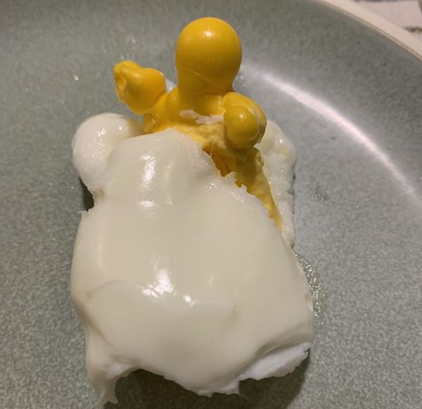 I was making hard-boiled eggs and one of them broke, and it looks like a baby sleeping in his bed.